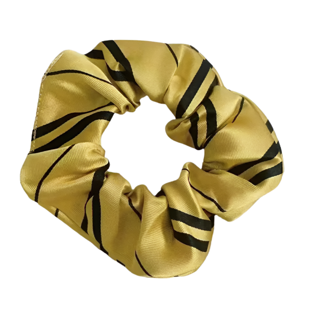 Gold scrunchie with black stripes on a white background