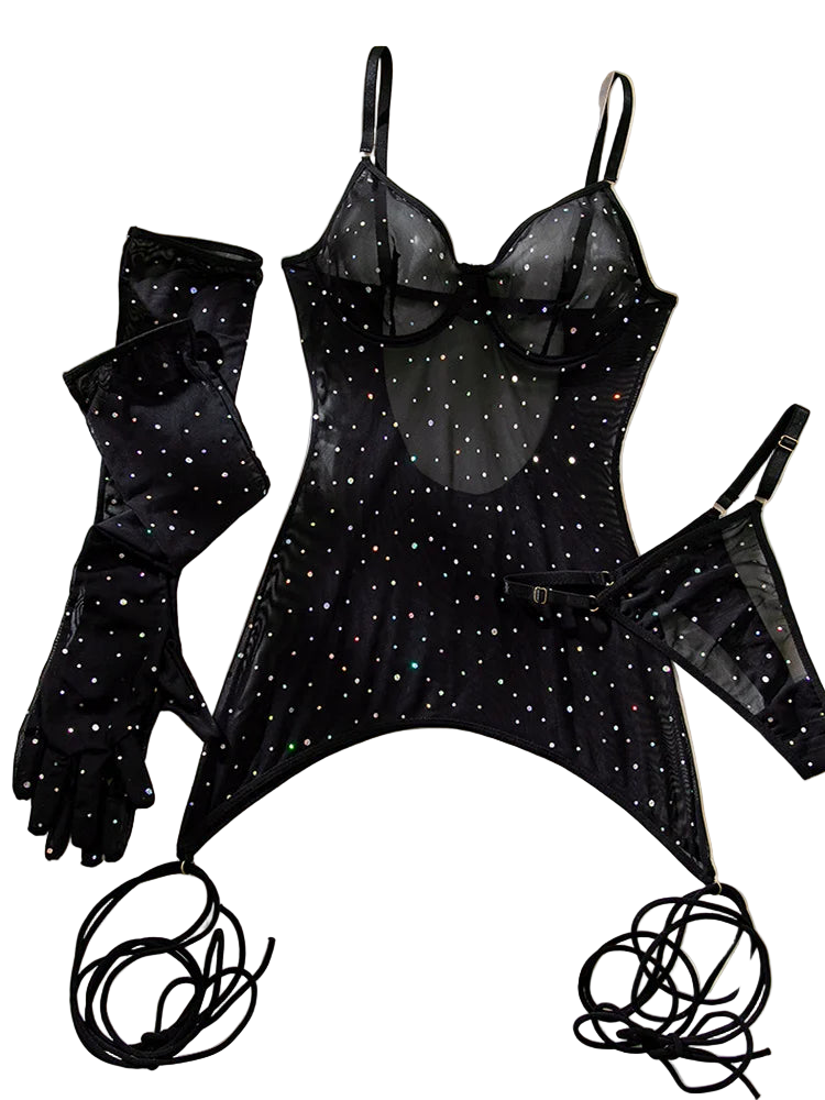 Black lingerie set with star patterns on a soft fabric background