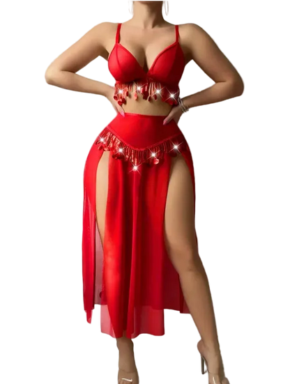 Red dress with a high slit and embellishments on a plain background