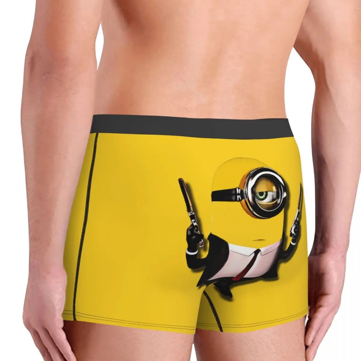 Yellow boxer briefs featuring minions a cartoon character in a suit holding guns.