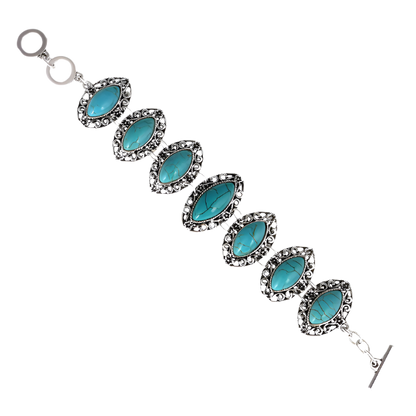 Turquoise stone bracelet with silver accents on a white background