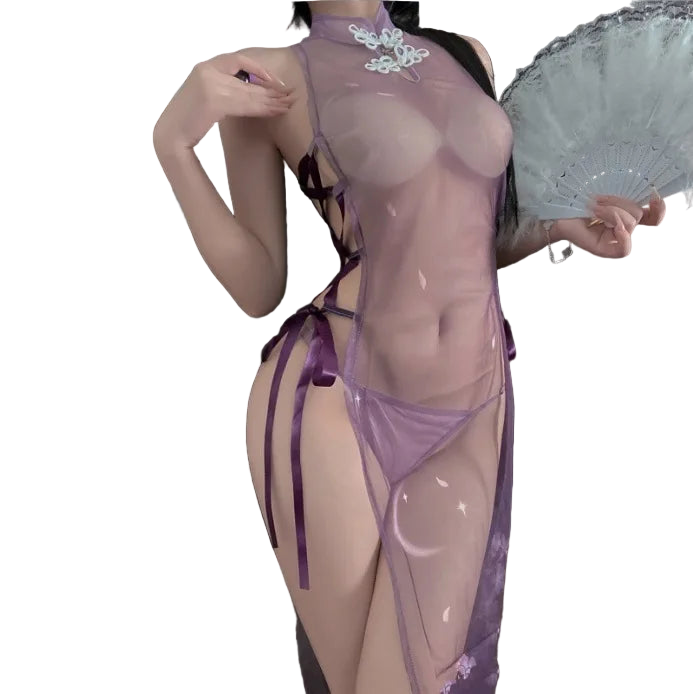 Person wearing a sheer purple outfit holding a fan in a dimly lit room.