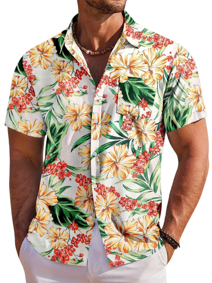 Man wearing a colorful floral short-sleeve shirt on a white background