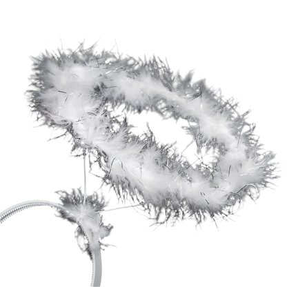 Close-up of a white feathered object against a black background