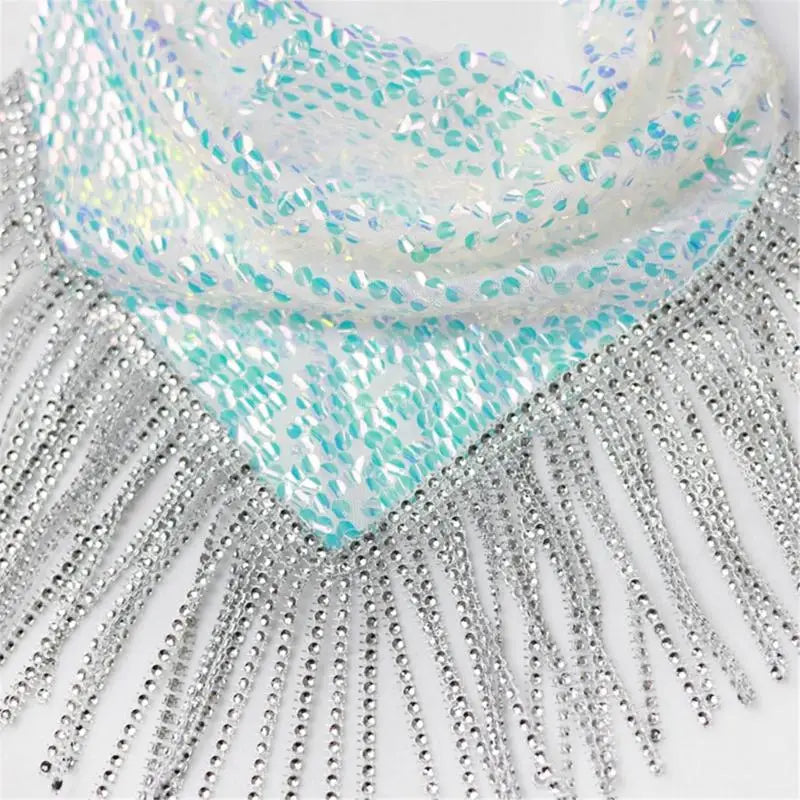 Close-up of a turquoise and silver decorative fabric with fringe