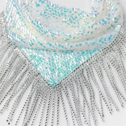 Close-up of a turquoise and silver decorative fabric with fringe