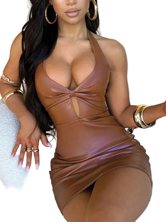 Woman wearing a brown leather dress with gold accessories.