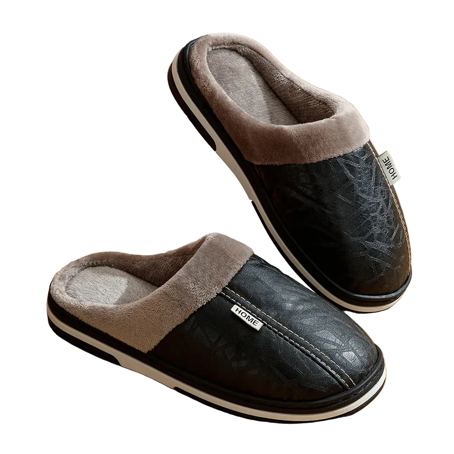 Black slippers with gray fur trim on a wooden floor
