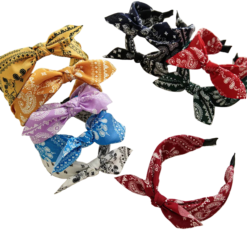 Colorful bandana headbands on a white surface