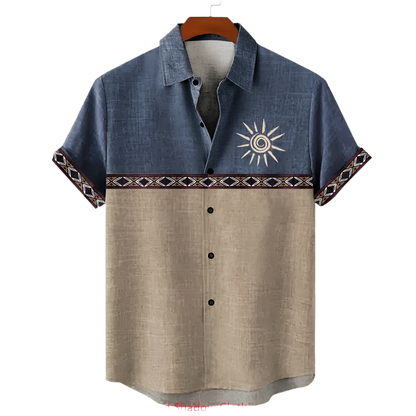 Two-tone shirt with sun design on a hanger against a white background
