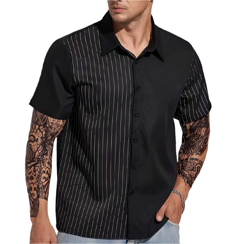 Man wearing a black short-sleeve shirt with white pinstripes on a plain background