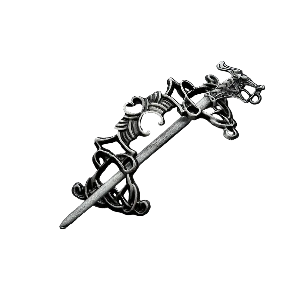 Decorative silver hairpin on a black textured background