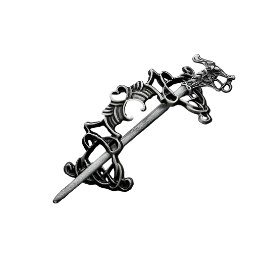 Decorative silver hairpin on a black textured background