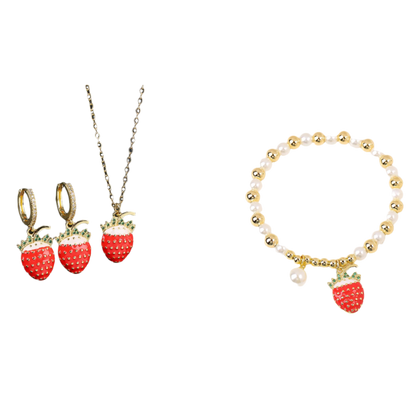 Jewelry set with strawberry-themed necklace, earrings, and bracelet on a black and white background.