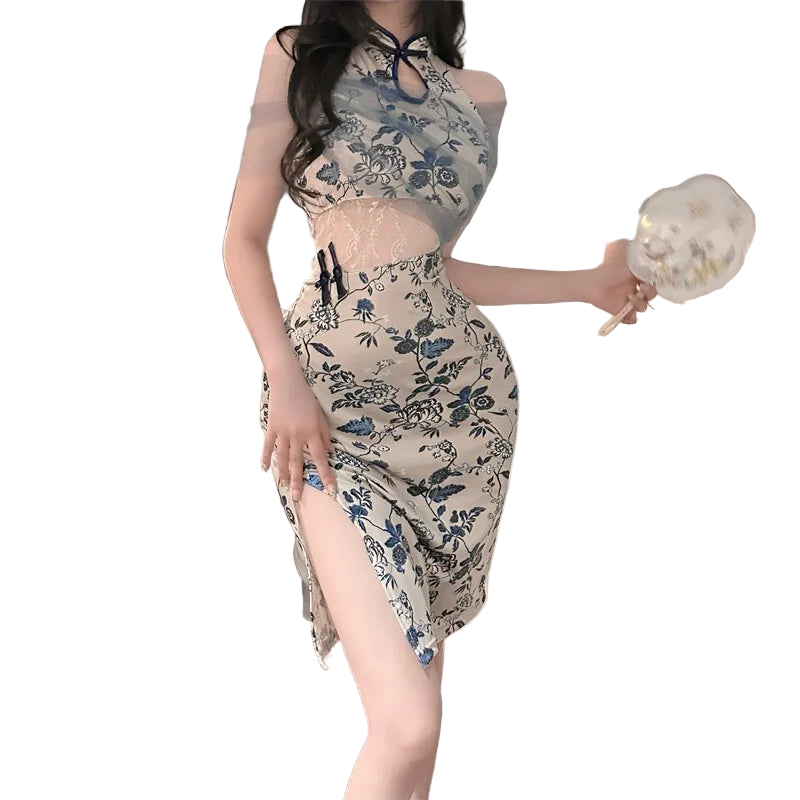 Woman in a floral dress standing in a bedroom