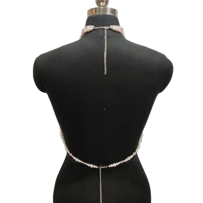 Pearl and chain body chain on a mannequin against a gray background