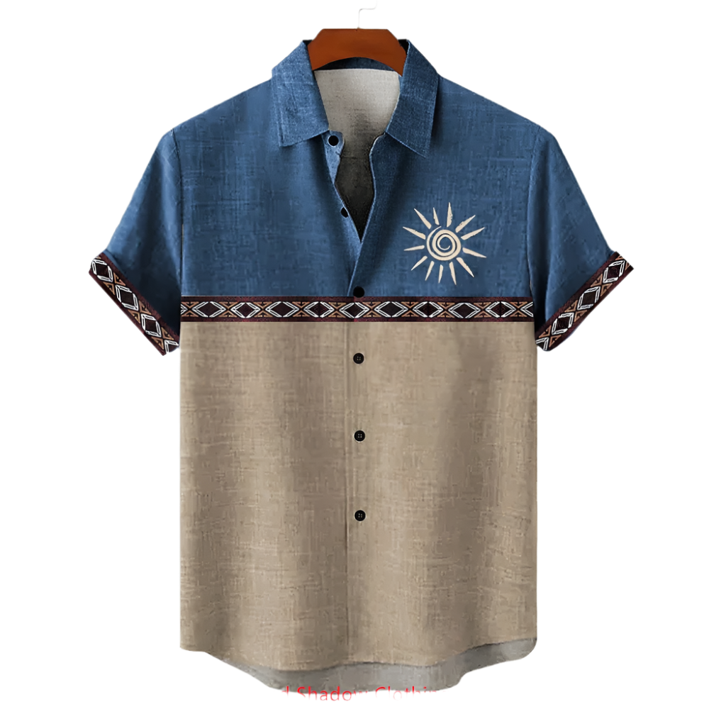 Two-tone shirt with sun design on a hanger against a white background