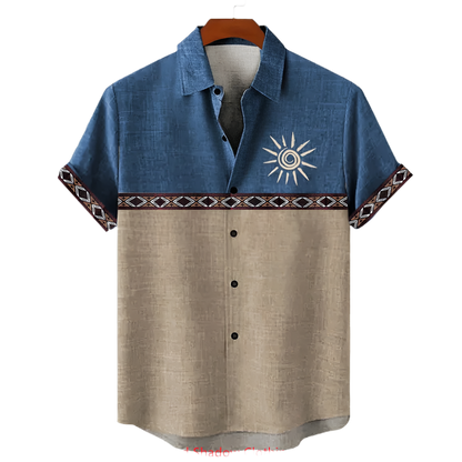 Two-tone shirt with sun design on a hanger against a white background
