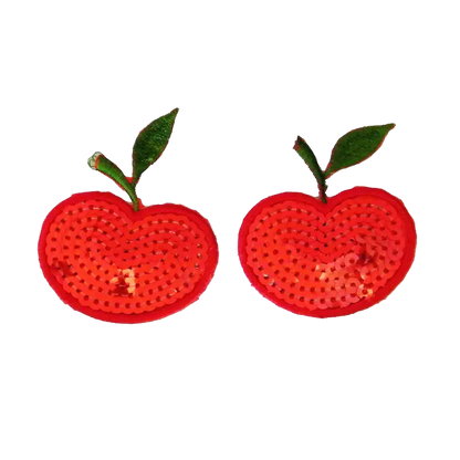 Pair of red apple-shaped earrings with green stems on a white background