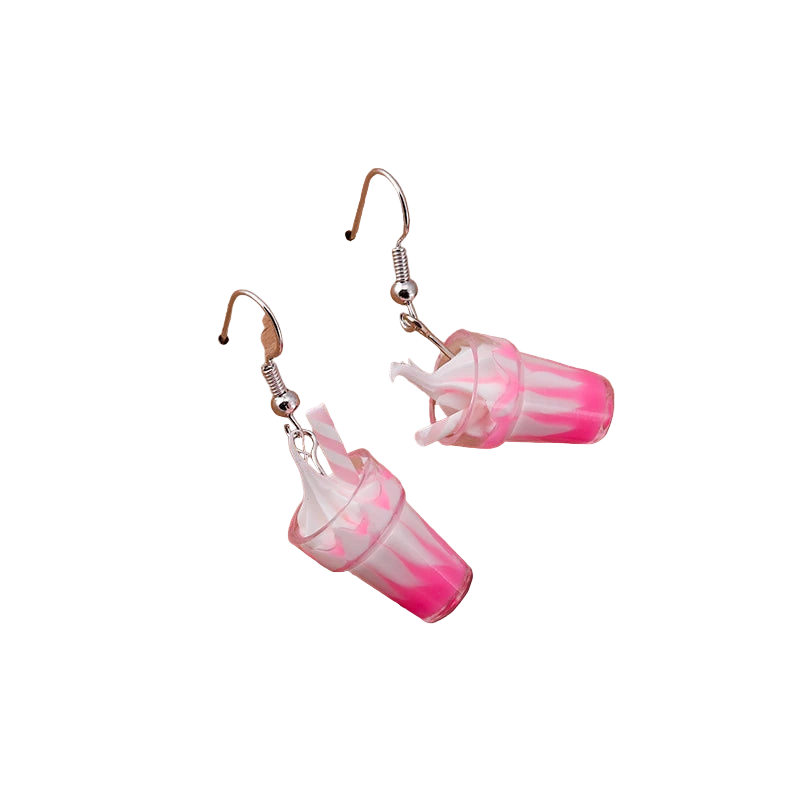 Pink and white cup earrings on a wooden block with 'Love Tea' text.