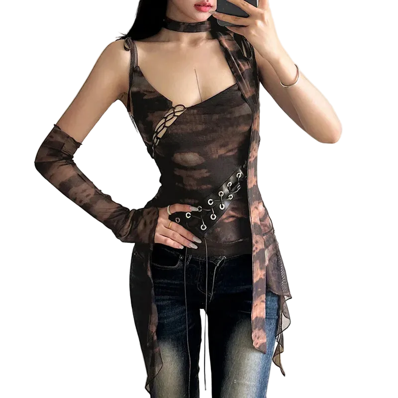 Woman wearing a sheer brown top with long sleeves and a black skirt in a room.