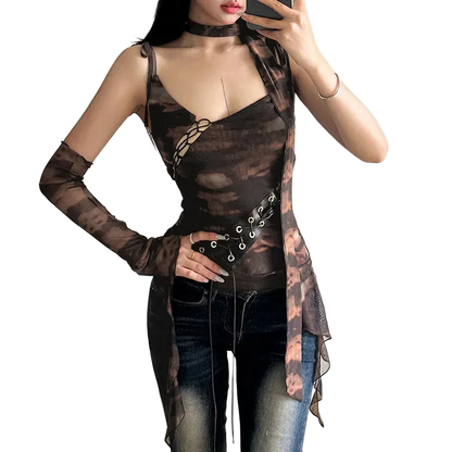 Woman wearing a sheer brown top with long sleeves and a black skirt in a room.