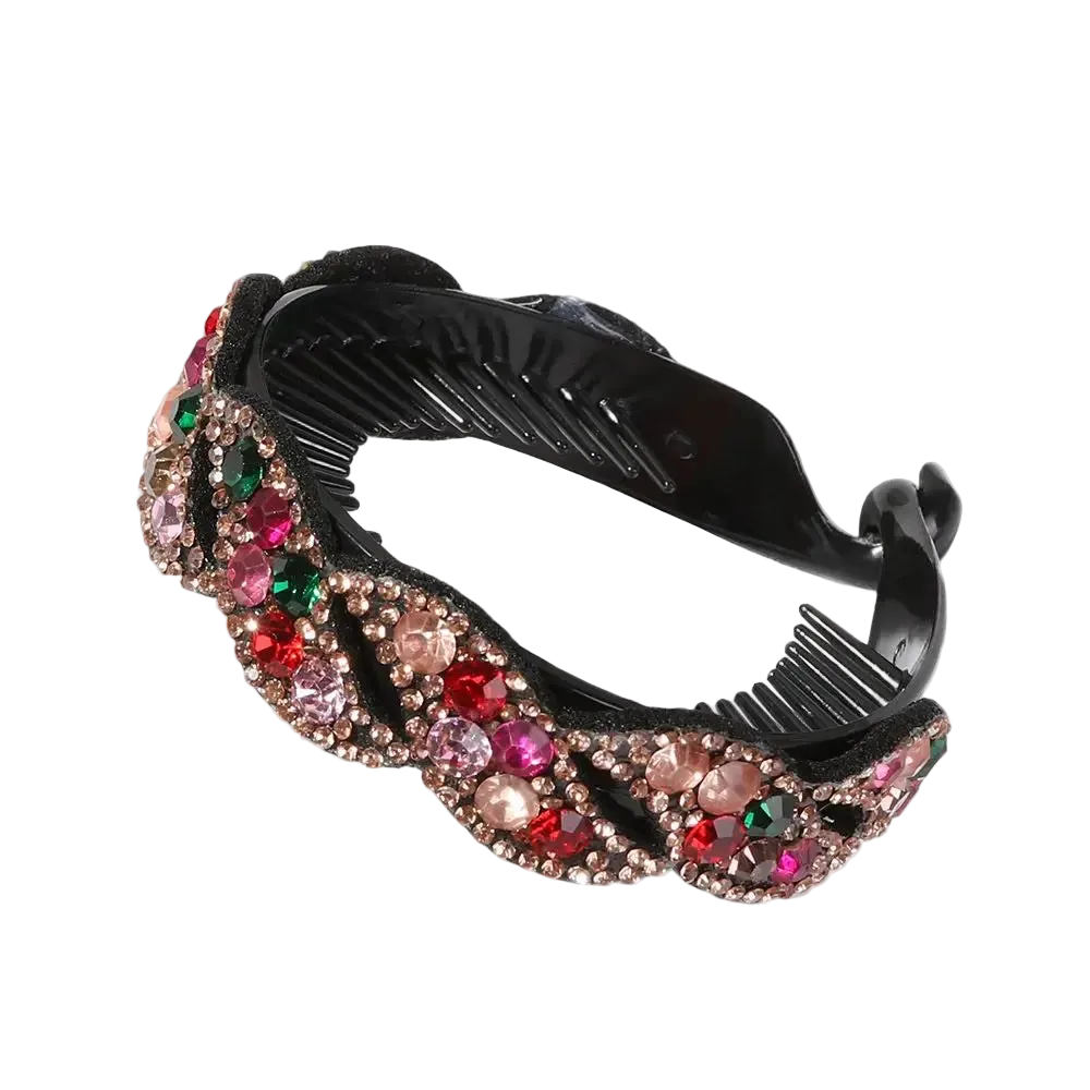 A black plastic hair comb embellished with a wavy border of pink, red, and green rhinestones on a white background.