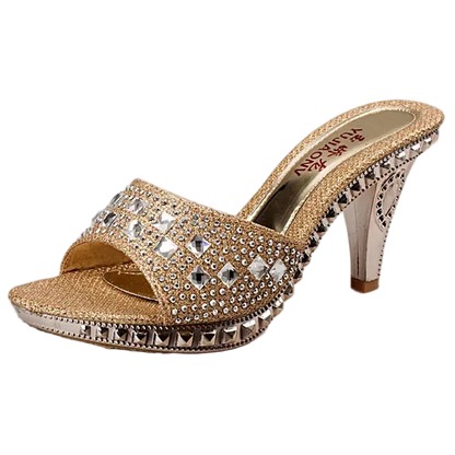 Gold high-heeled shoe with rhinestone embellishments on a white background