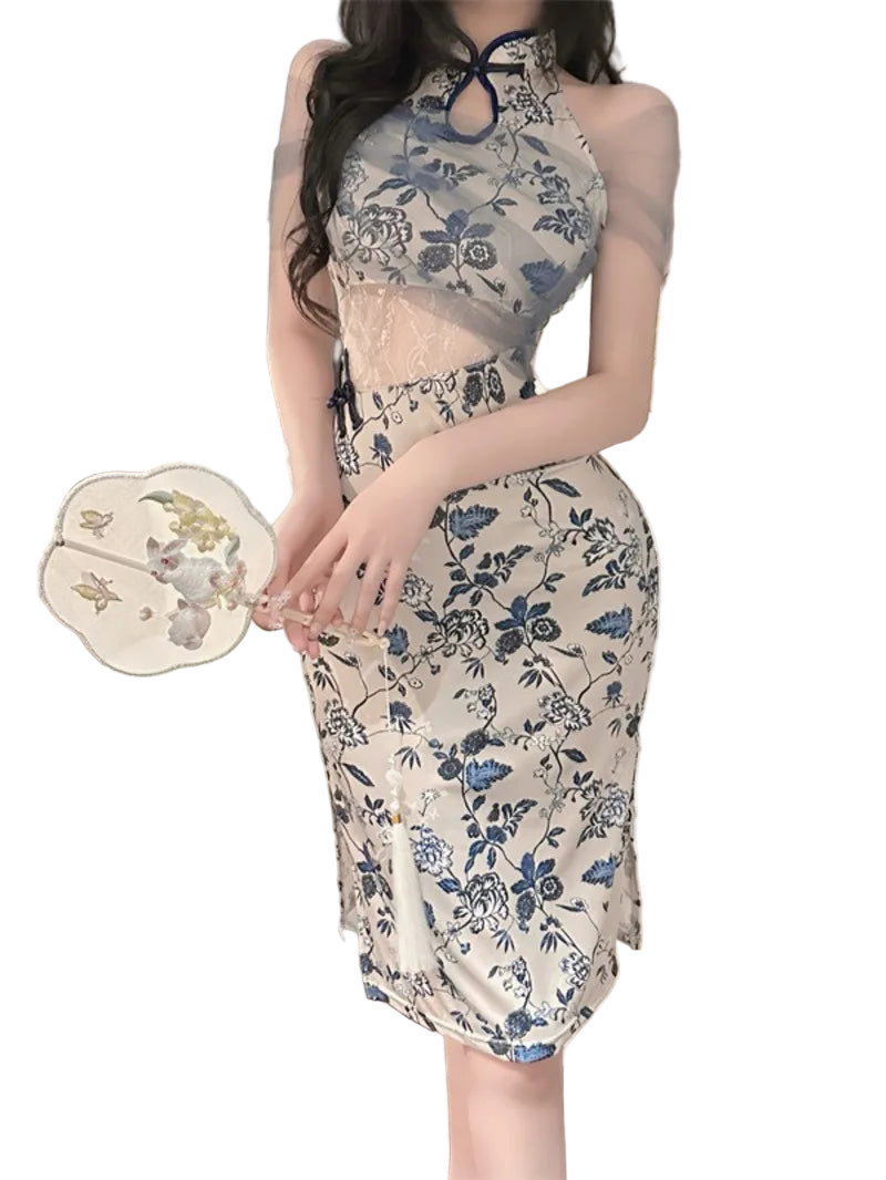 Woman wearing a floral dress in a bedroom setting