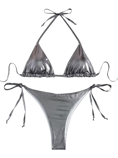 A shiny, iridescent bikini in shades of grey. It features a classic triangle top and tie-side bottoms, creating a vibrant and eye-catching beachwear style.