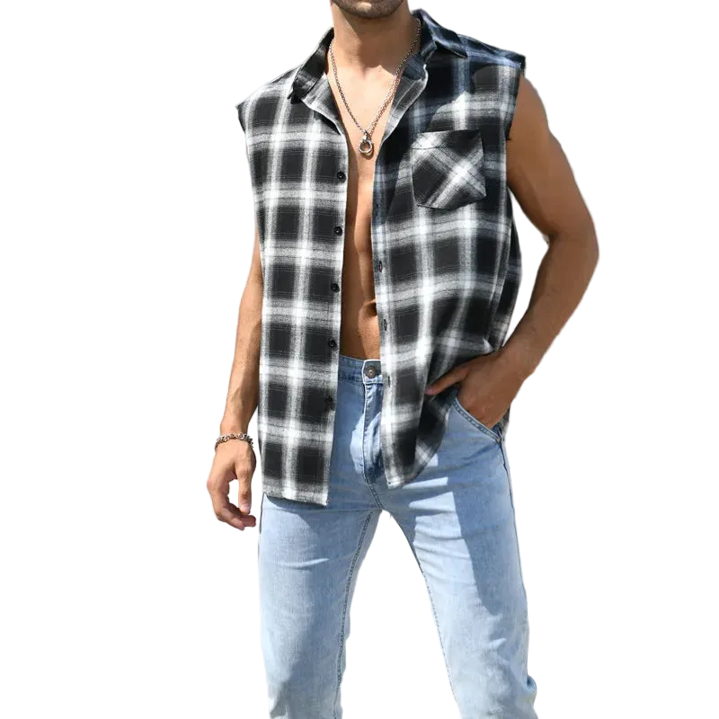 Man wearing a black and white checkered sleeveless shirt and light blue jeans standing on steps.