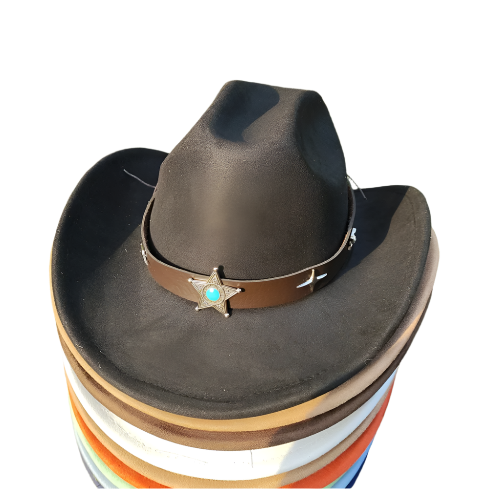 Black cowboy hat with a star emblem on a stack of colorful buckets on grass