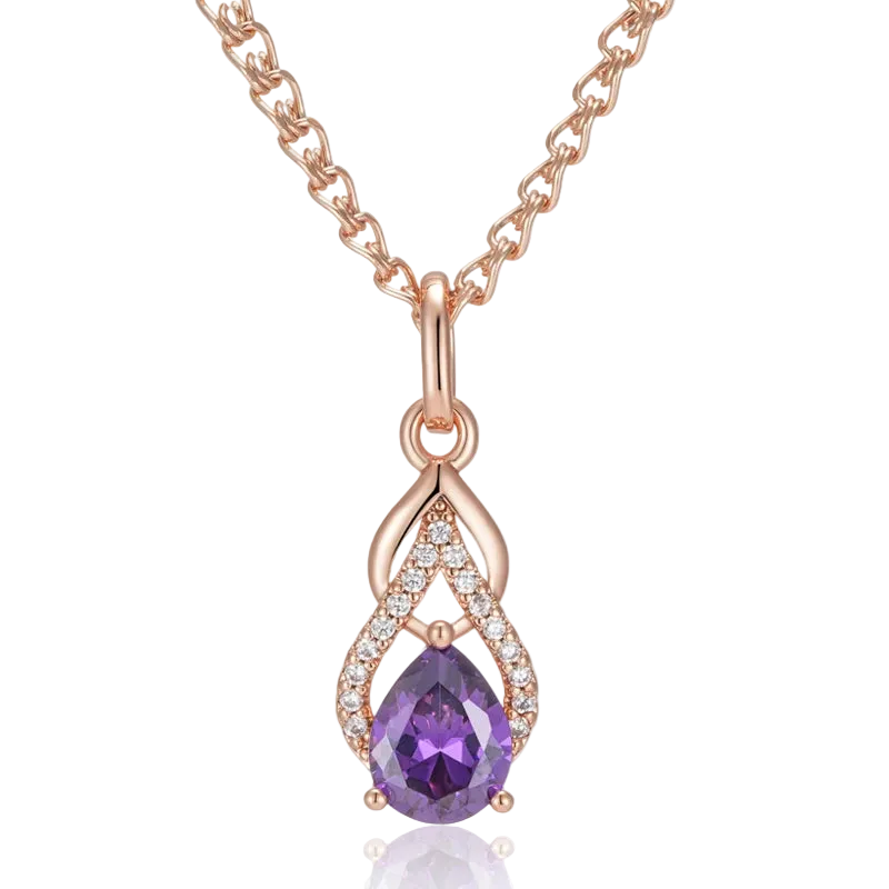 Rose gold necklace with a purple teardrop pendant on a white background