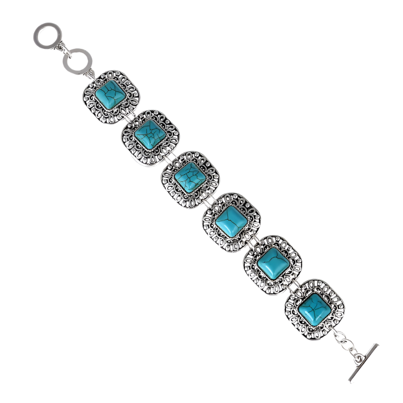 Turquoise stone bracelet with silver accents on a white background