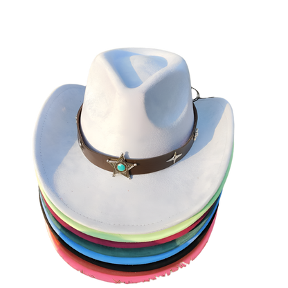 Stack of colorful cowboy hats with a star emblem on a grassy background