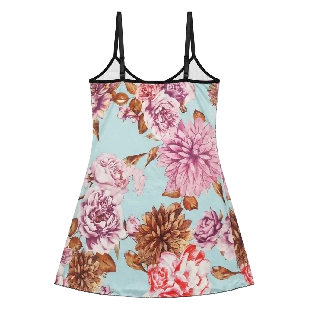 A sleeveless camisole-style nightgown with thin black shoulder straps and a light blue background covered in a large floral print featuring pink, mauve, and brown flowers.