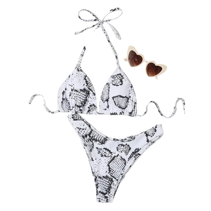 Snakeskin-patterned bikini set with a hat and sunglasses on a white background