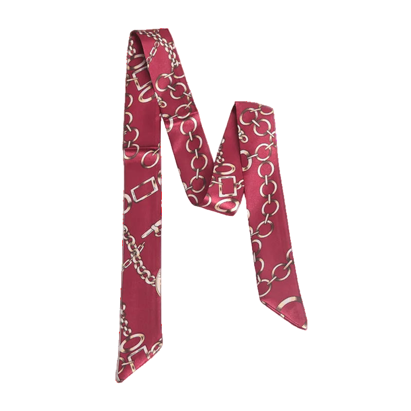 Red scarf with white pattern on a marble surface