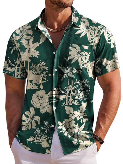 Man wearing a green floral patterned shirt against a white background