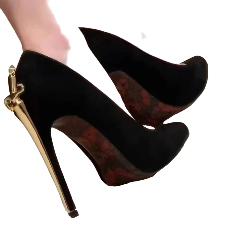 Black high-heeled shoes with gold accents on a neutral background