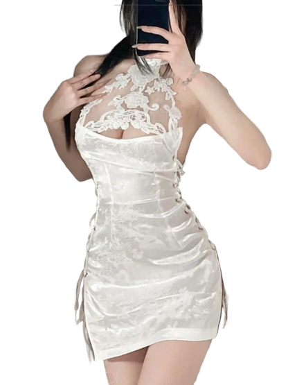 White lace dress worn by a person, with a neutral background