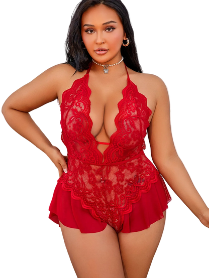 Woman wearing a red lace lingerie set in a well-lit room.