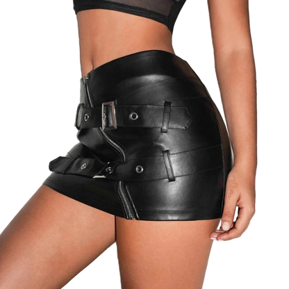 Black leather shorts with buckles worn by a person on a neutral background