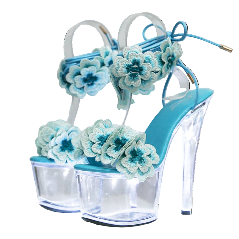 Blue high-heeled shoes with floral decorations on a white background