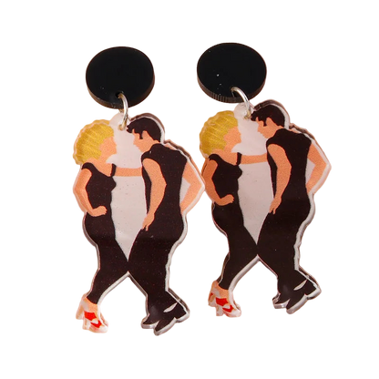 Dance earrings with characters in black outfits on a beige background