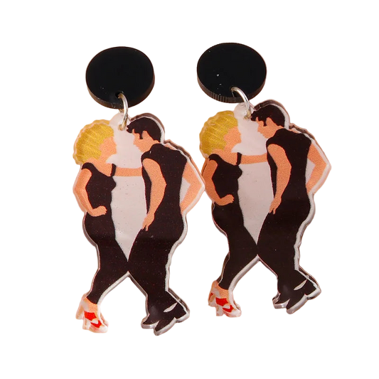 Dance earrings with characters in black outfits on a beige background