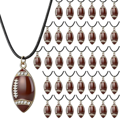 A football-shaped pendant necklace with a glossy dark brown body, gold-tone trim, white lacing detail, and small clear rhinestones, shown on a black cord. The main pendant is large and detailed, while the background contains many smaller repeated views of the same pendant on black cords.