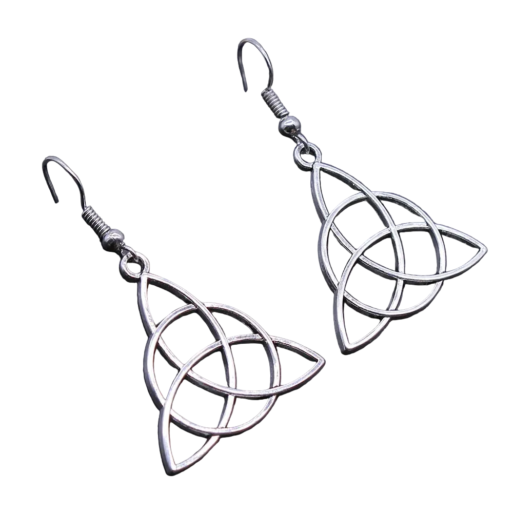 A pair of silver-toned dangle earrings with interlocking knot-like cutout shapes, shown on a dark textured surface.