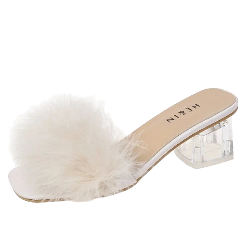 White fur slide sandal with clear heel on a white background