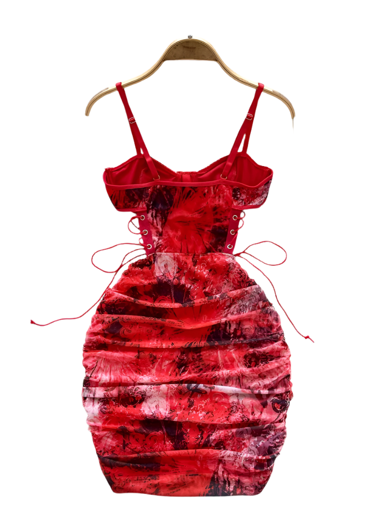 Red tie-dye dress on a hanger with a white floral background